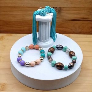 Set of 3 Vintage jewelry Pieces, 2 beaded Stretchy Bracelets and Tassel Earrings